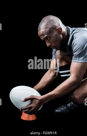 Maintien sportif rugby ball kicking tee sur Banque D'Images