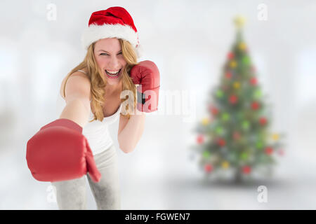 Image composite de blonde de fête avec des gants de boxe boxe Banque D'Images