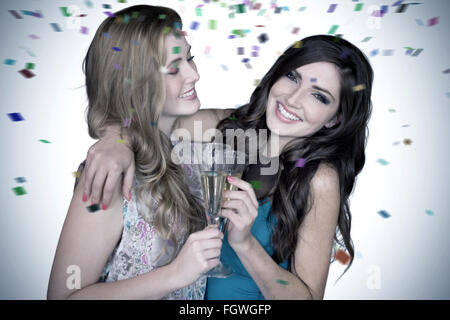 Image composite de friends drinking champagne Banque D'Images