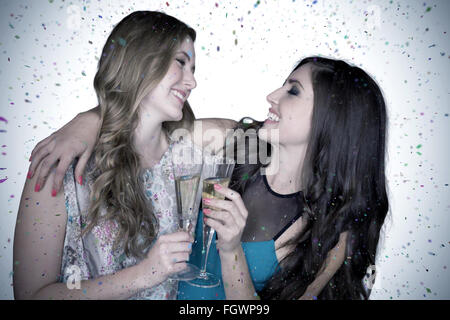 Image composite de friends drinking champagne Banque D'Images