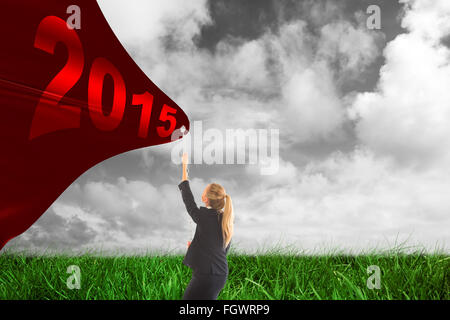 Image composite de businesswoman pulling une chaîne Banque D'Images