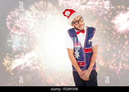 Image composite de hipster geek in santa hat Banque D'Images