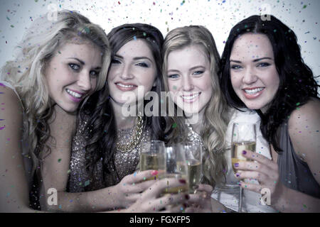 Image composite de friends drinking champagne Banque D'Images