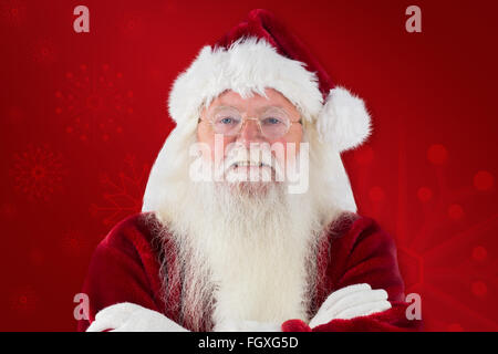 Image composite de santa smiles with folded arms Banque D'Images