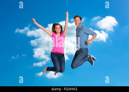 Image composite de cheerful young couple jumping Banque D'Images