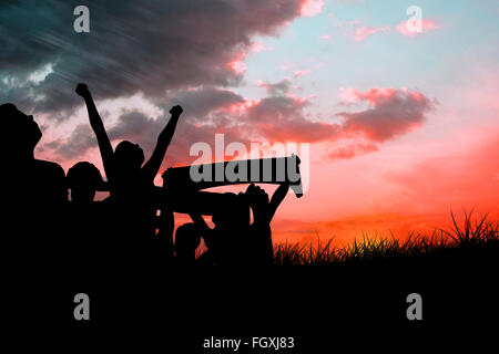 Image composite de silhouettes de supporters de football Banque D'Images