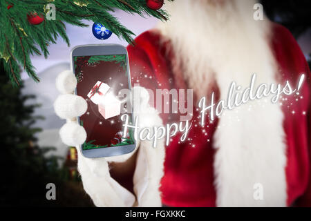 Image composite de santa claus smartphone montrant Banque D'Images