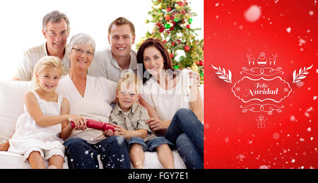 Image composite des enfants tirant les crackers de Noël dans Banque D'Images