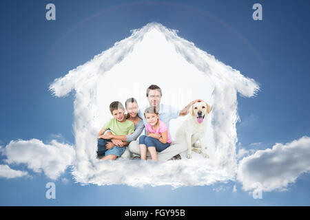 Image composite de la famille mignon avec le pet labrador posing and smiling at camera ensemble Banque D'Images