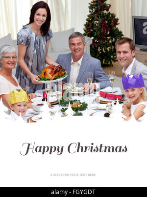 Image composite de family celebrating christmas dinner avec la Turquie Banque D'Images