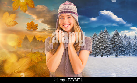 Composite image in winter clothes posing Banque D'Images