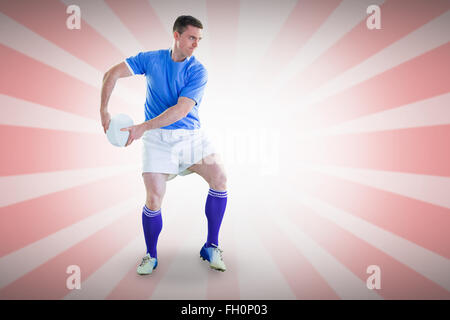 Image composite de rugby player sur le point de lancer un ballon de rugby Banque D'Images