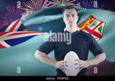 Image composite de rugby player with arms crossed Banque D'Images