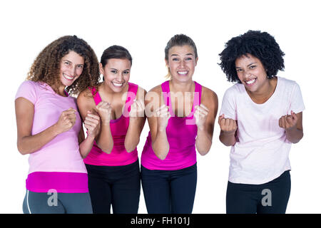 Portrait of smiling groupe de femmes avec les mains jointes Banque D'Images