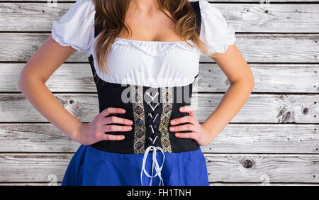 Image composite de l'Oktoberfest Girl standing with hands on hips Banque D'Images