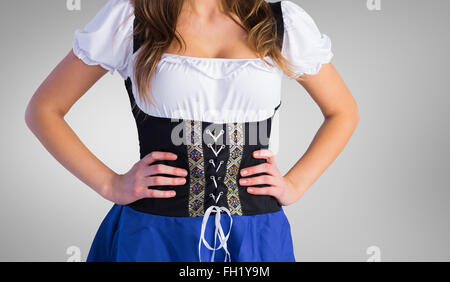 Image composite de l'Oktoberfest Girl standing with hands on hips Banque D'Images