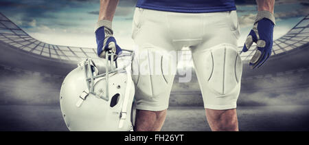 Image composite de midsection of american football player holding helmet Banque D'Images