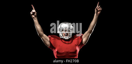 Image composite de joueur de football américain avec bras levés debout Banque D'Images