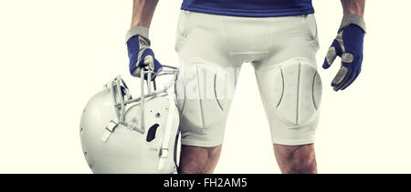 Image composite de midsection of american football player holding helmet Banque D'Images