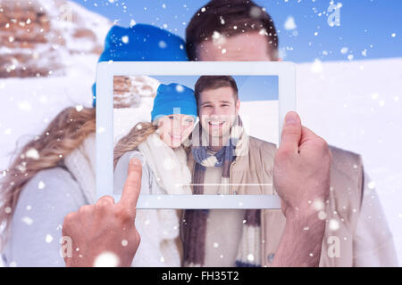 Image composite de hand holding tablet pc Banque D'Images