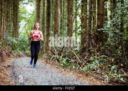 Jolie blonde woman running Banque D'Images