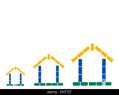 Maisons assemblées à partir de blocs de construction jouets Banque D'Images