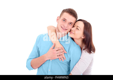 Belle Jeune femme debout derrière son petit ami dans ses bras avec les yeux fermés Banque D'Images