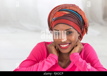 Studio portrait of African woman wearing headscarf Banque D'Images