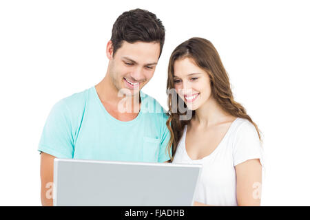 Heureux couple using a laptop Banque D'Images