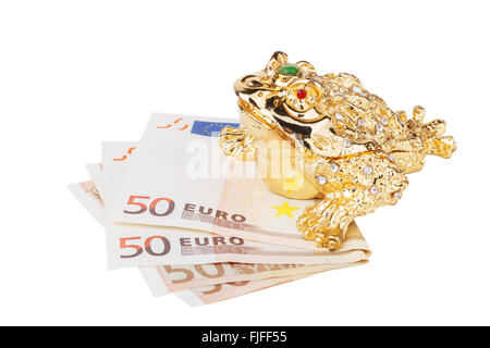 Feng shui chinois lucky money frog assis sur l'argent Banque D'Images