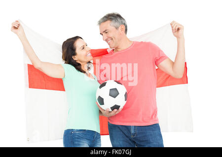 Couple amateur de football excité cheering at camera Banque D'Images