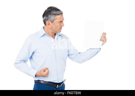 Angry Man holding blank paper Banque D'Images