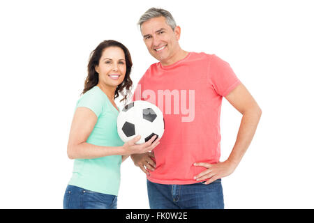 Couple amateur de football excité cheering at camera Banque D'Images