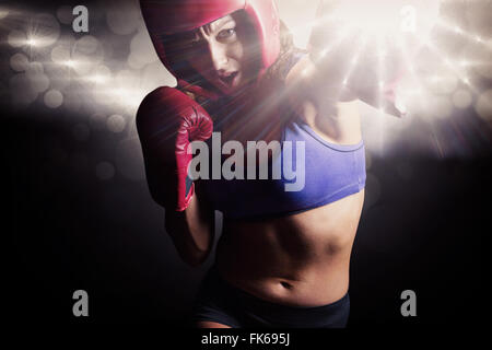 Image composite de boxer avec des gants de boxe et coiffures Banque D'Images