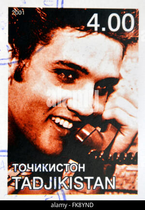 Tadjikistan - circa 2001 : timbres en Tadjikistan montre Elvis Presley, vers 2001 Banque D'Images