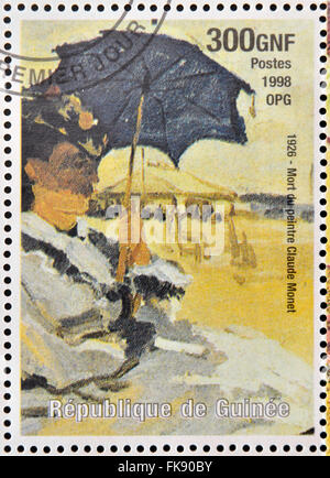 Guinée - circa 1998 : timbre imprimé en République de Guinée commémore la mort du peintre Claude Monet, vers 1998. Banque D'Images