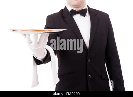 Portrait d'un jeune garçon tenant un plat vide sur fond blanc Banque D'Images