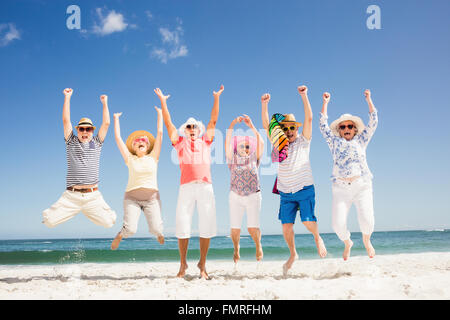 Happy friends jumping Banque D'Images