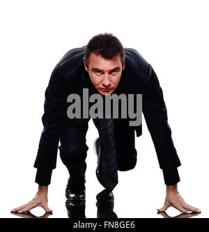 Un homme d'affaires caucasiennes sur bloc de départ en silhouette sur fond blanc Banque D'Images