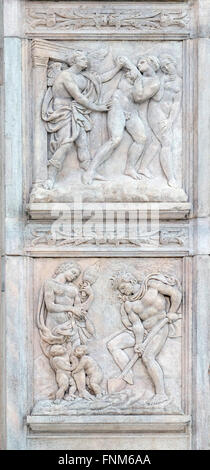 Expulsion du Paradis, le travail d'Adam et Eve, le panneau sur la porte centrale de la Basilique San Petronio à Bologne, Italie Banque D'Images