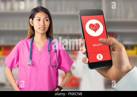 Image composite de l'infirmière asiatique avec stéthoscope regardant la caméra Banque D'Images