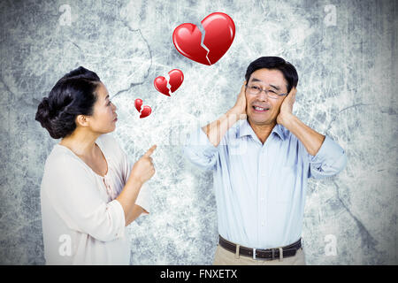 Image composite de l'older asian couple having an argument Banque D'Images