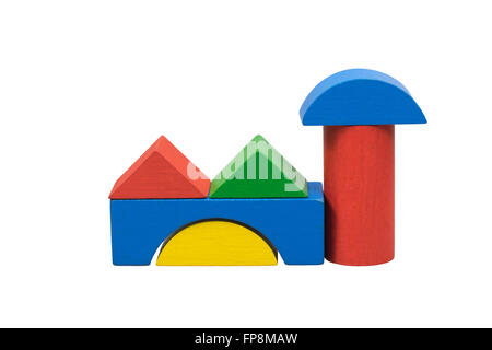 Usine construite à partir de formes en bois (jouets) isolé sur un fond blanc. Banque D'Images