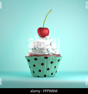 La cerise sur le gâteau la métaphore. Délicieux petit gâteau garni d'une cerise et la crème fouettée et des sucreries. Banque D'Images