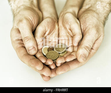 Papa et sa fille holding euro pièces. Banque D'Images