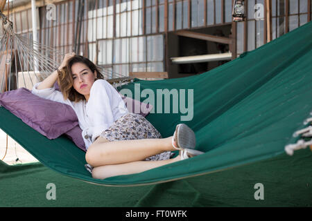 Young Woman resting on Hammock