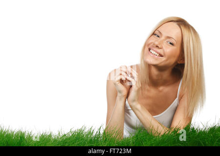 Smiling Beautiful woman on grass isolated on white background Banque D'Images