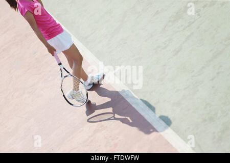 Jeune joueur de tennis japonais en action Banque D'Images