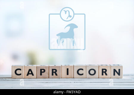 Capricorne signe du zodiaque sur une table en bois Banque D'Images