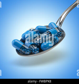 Concept de la médecine. Cuillère pleine de capsules et comprimés sur le fond bleu. Antécédents médicaux.3d Banque D'Images